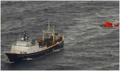A helicopter lifts an injured man from the deck of the Alaska Juris in June 2013. The vessel was owned by Fishing Company of Alaska